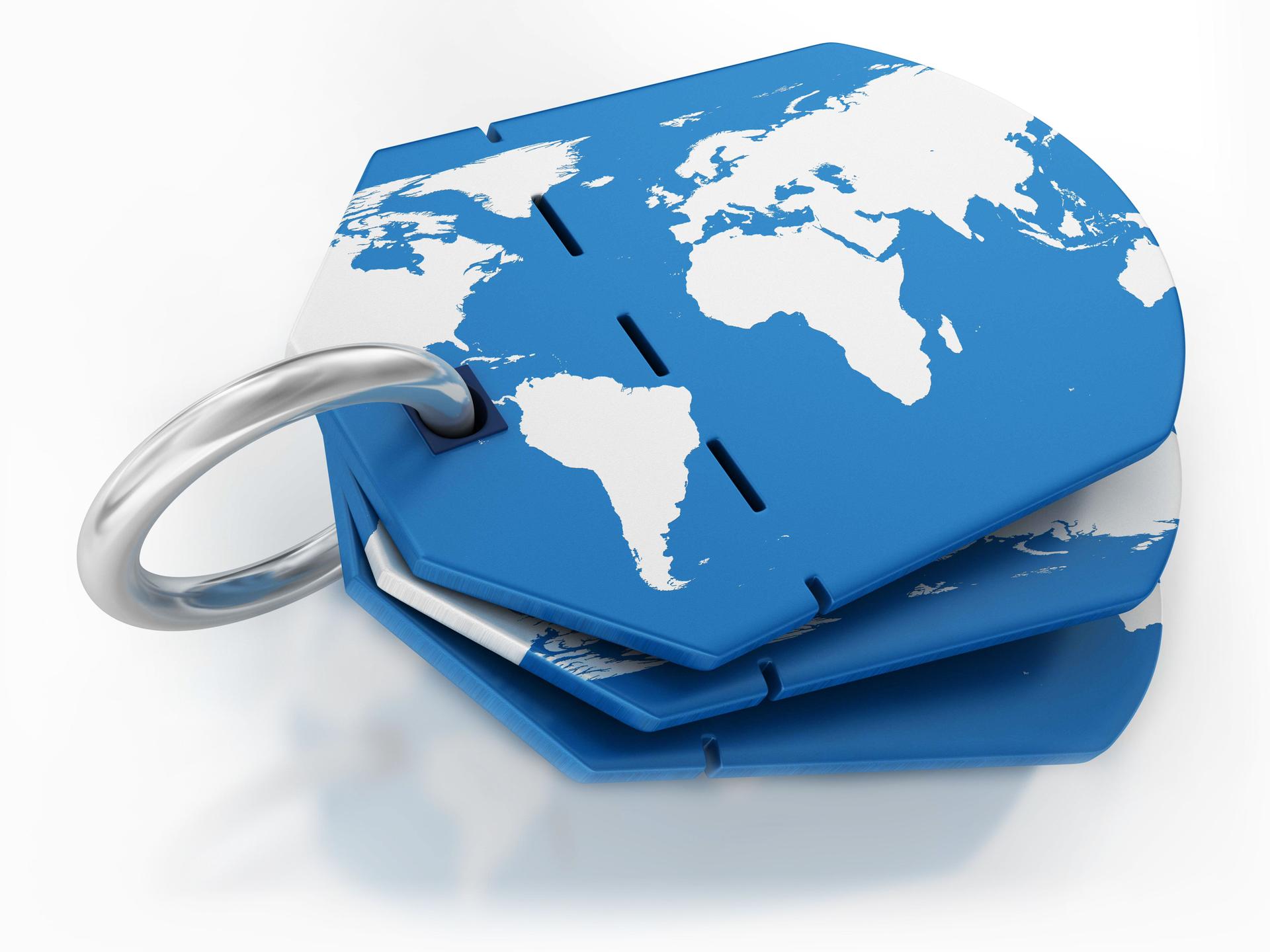 Blue Keychain With World Map Design Representing Global Travel and Exploration.