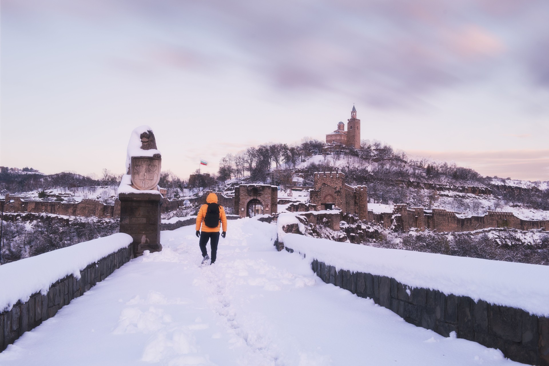 Man exploring castle in the winter
