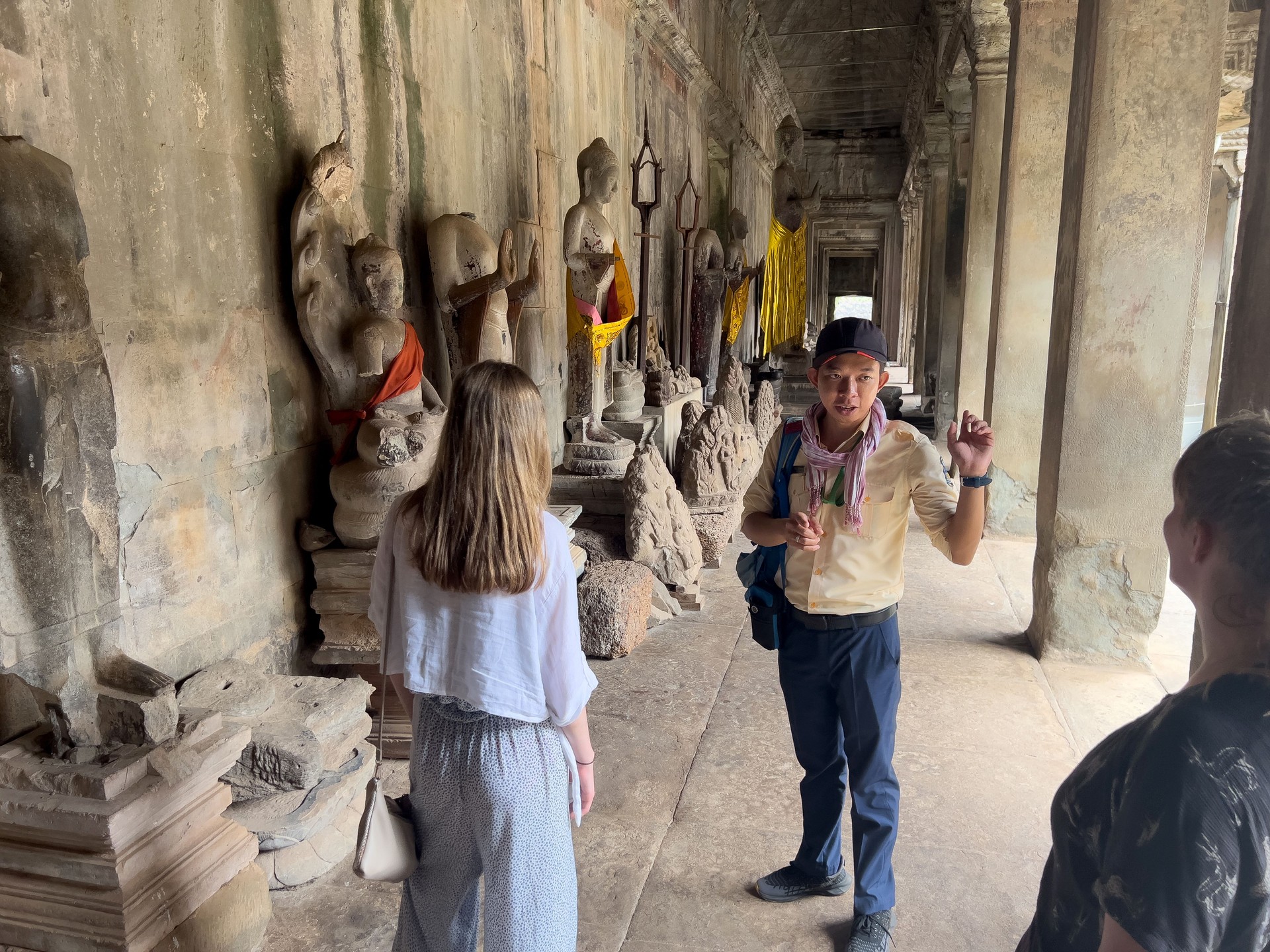 Listening To The Guide in Ankor Wat.